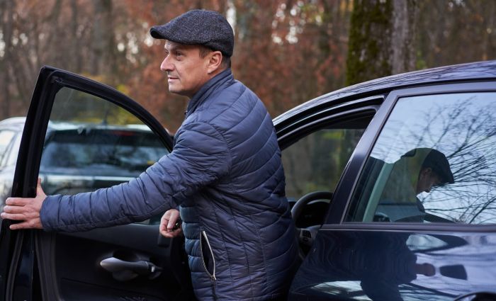 Employee getting into personal car