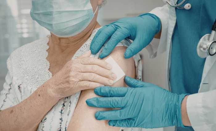 Caregiver administering medication